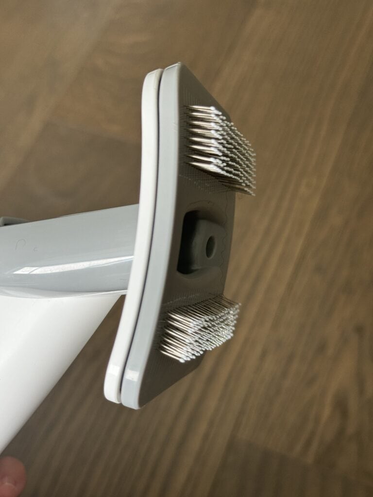 A side view of the brush attachment showing the width of the wire bristles.