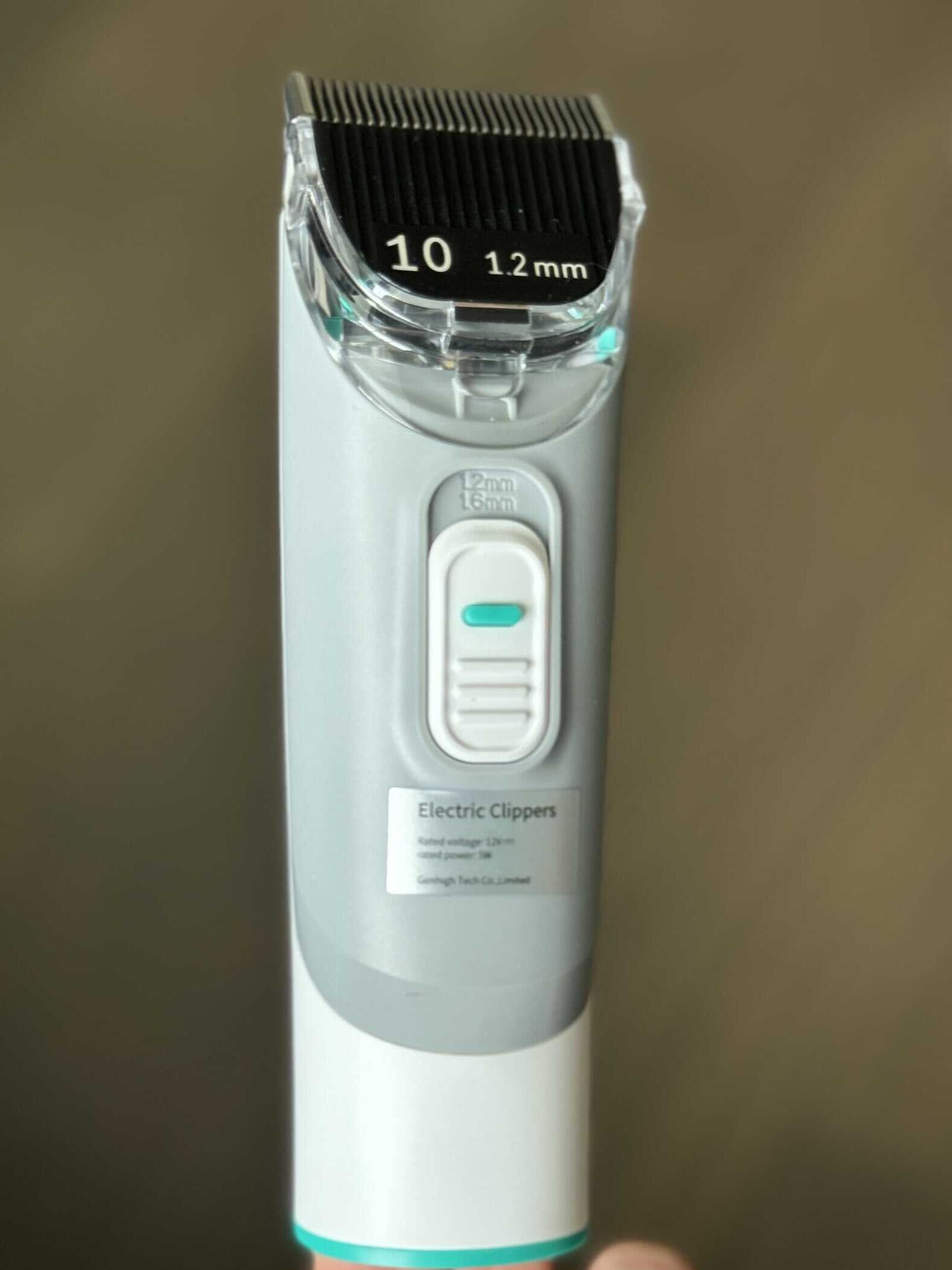 A dog grooming clipper attachment for a pet grooming vacuum system.